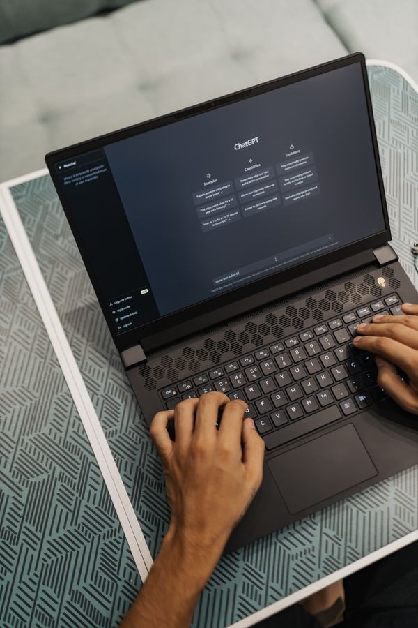 Laptop showing an AI assistant interface for practical workflow planning