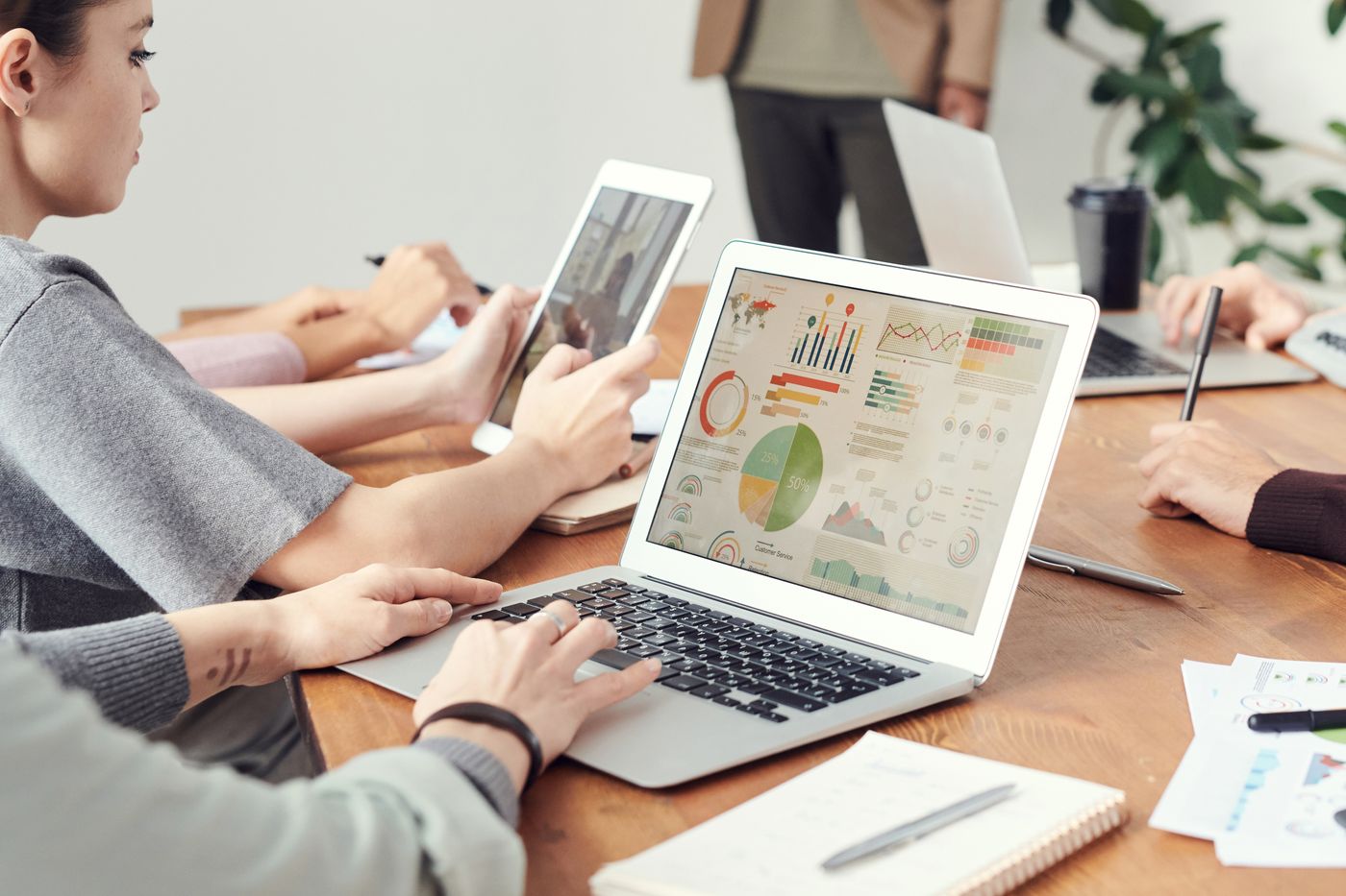 People reviewing website growth data at a laptop